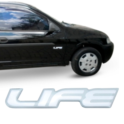 Emblema 'LIFE' - Chevrolet Celta / Corsa 2003/2006 - Transparente / Contorno Prata / Resinado