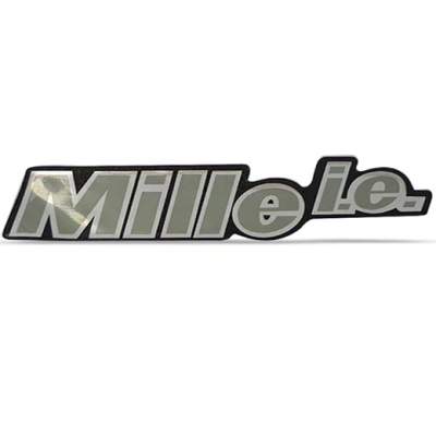 Emblema 'Mille i.e.' - Fiat Uno Mille Após 1996 - Cinza / Contorno Preto / Resinado