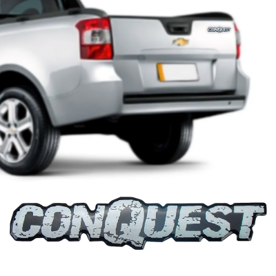 Emblema 'CONQUEST' - Chevrolet Montana 2004/2012 - Prata / Fundo Preto / Resinado